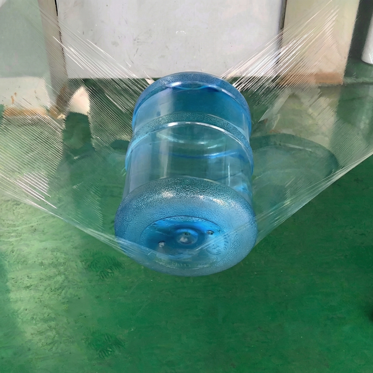 Water jug strength test, an example of palletizing and securing fragile goods for distribution and sale.
