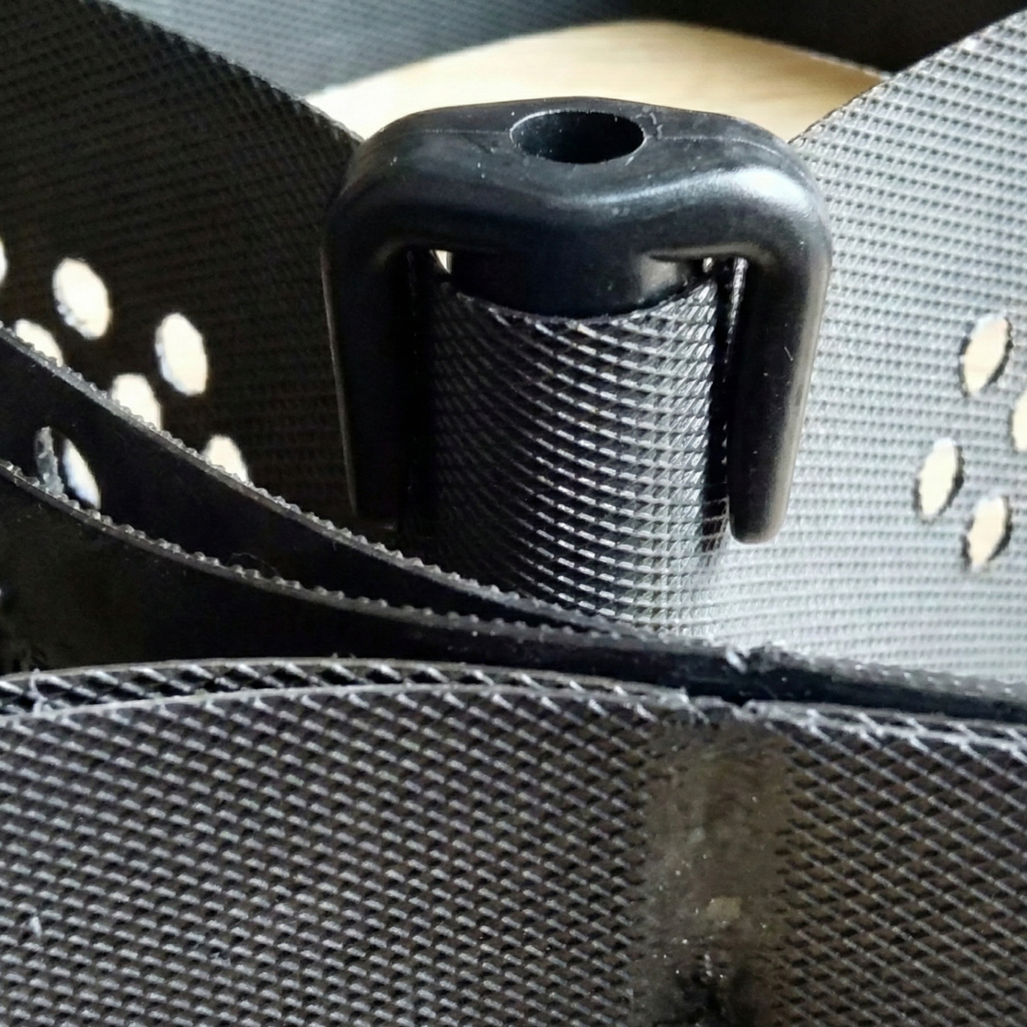 Anchor cap placed on the edge of a perforated black geocell for engineering projects in Santiago, DR.