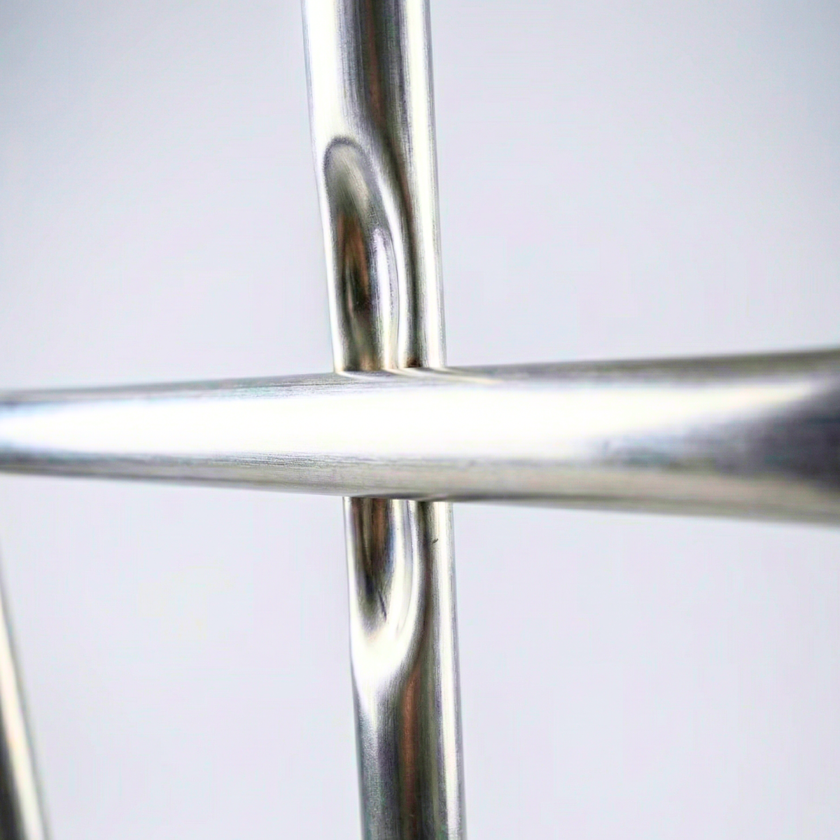 Detail of the galvanized tubular metal cage of an IBC container for safe storage in the Dominican Republic.