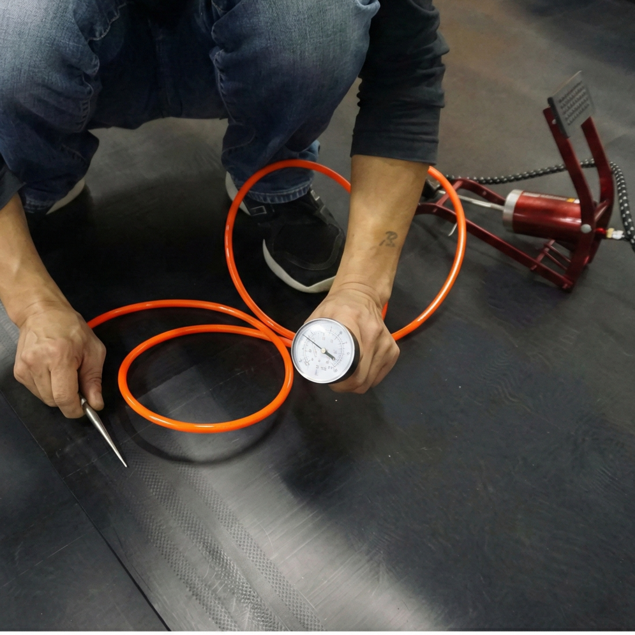 Air pressure gauge in use to verify the weld quality of liner and geomembranes in projects in the Dominican Republic.