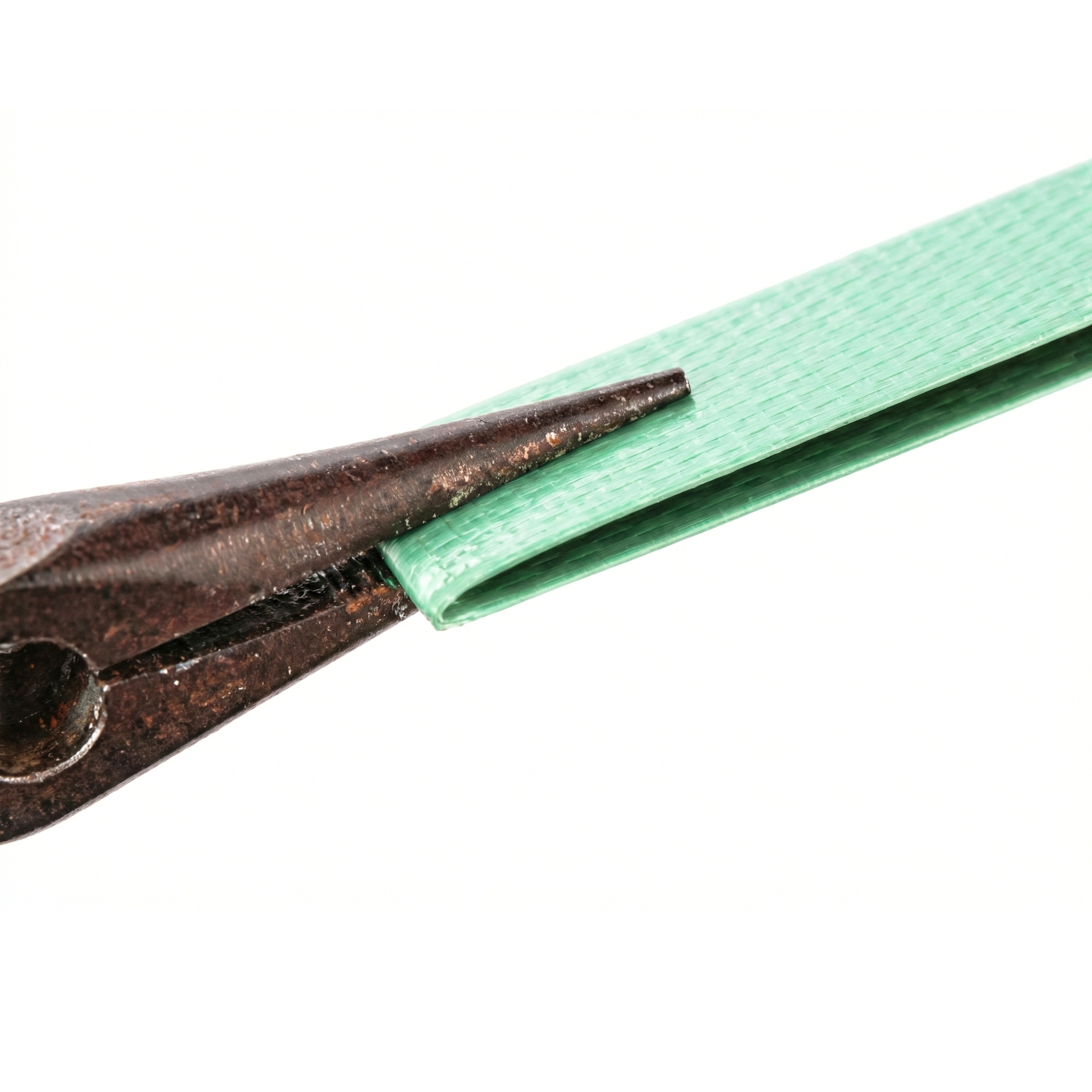 Manual flexibility and resistance test of green polyester strapping material using needle-nose pliers to bend it without breaking.