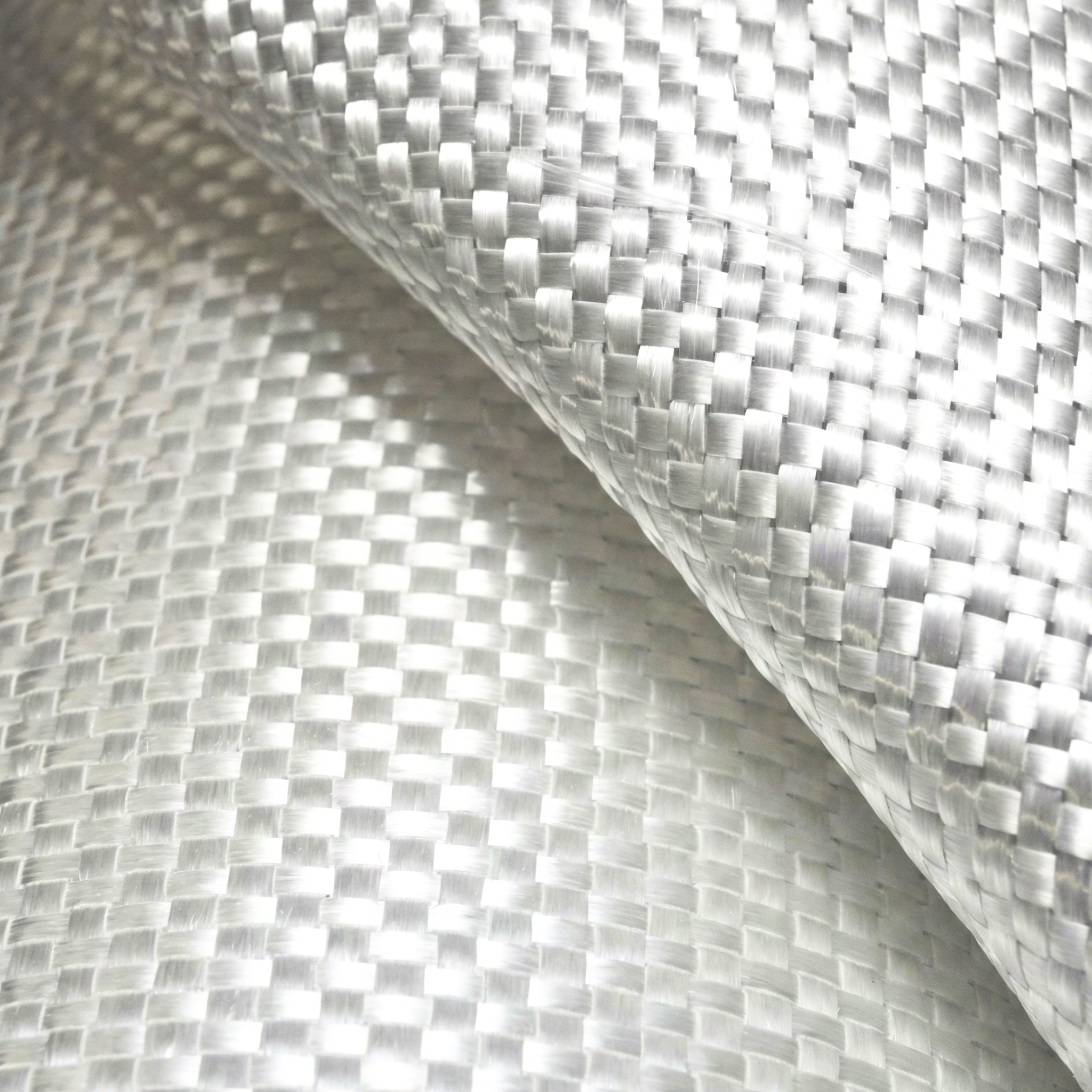 Detail of the texture of a white woven geotextile, an ideal material for filtration and drainage systems in construction.