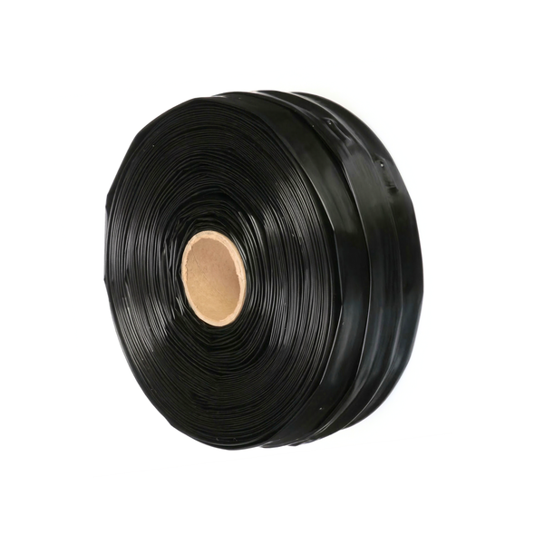 Self-compensating drip irrigation tape