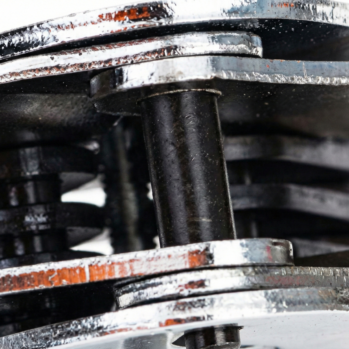Close-up of the metal tensioning mechanism of a strapping clincher.