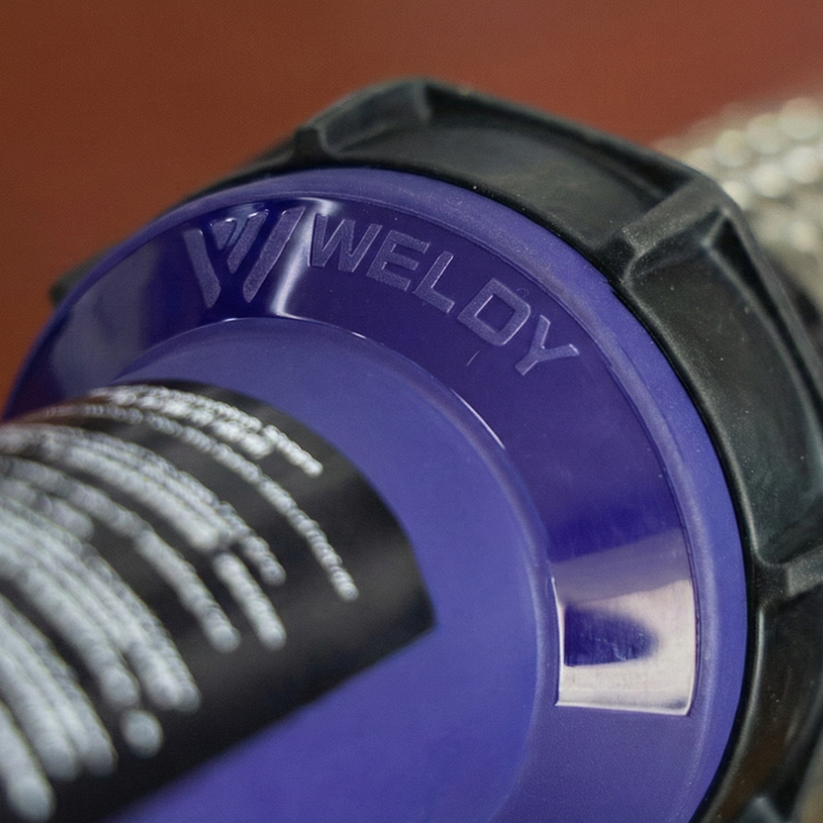 Detail of the motor and rear housing of a plastic welding machine or industrial hot air gun (industrial blower), showing the air intake and robust construction.