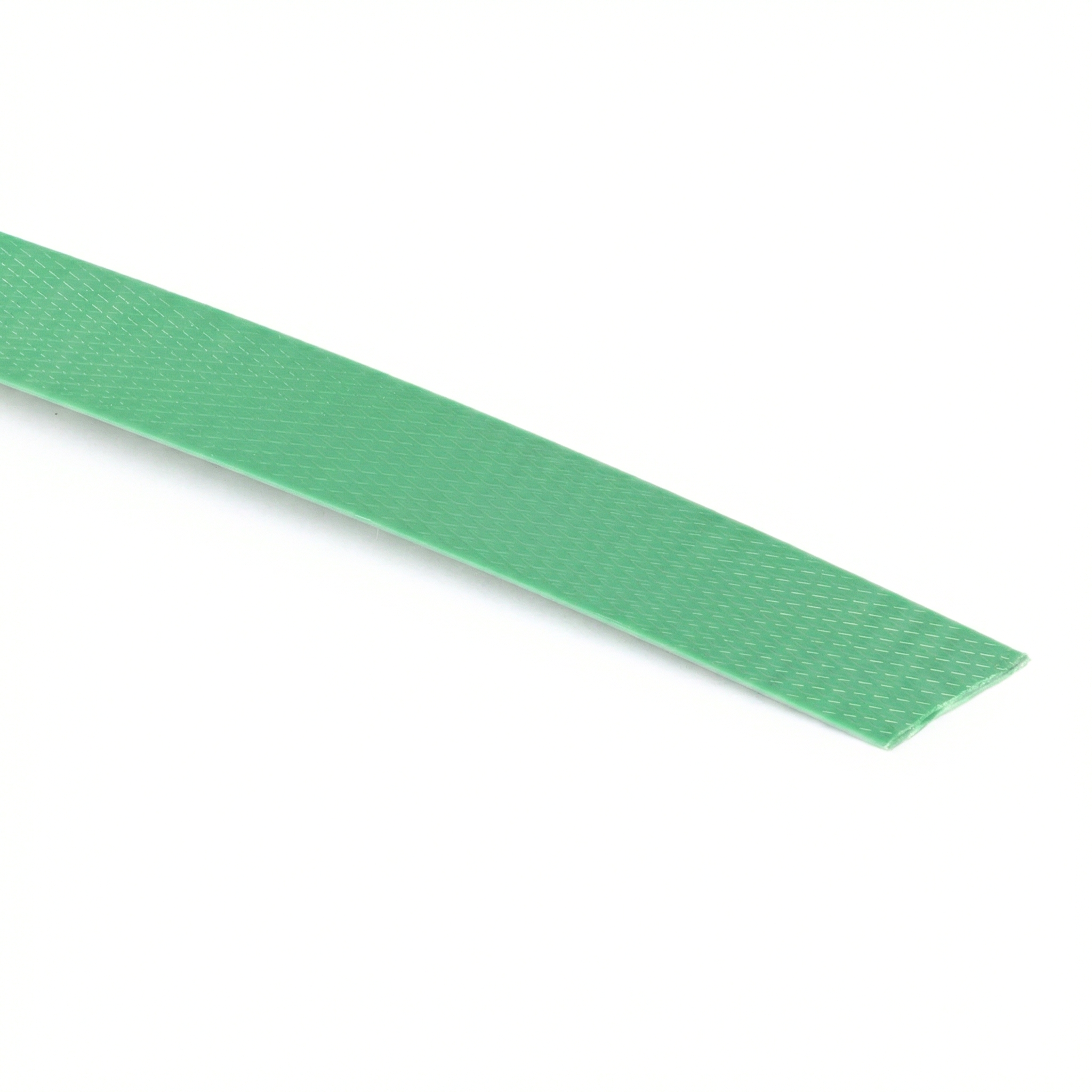 Close-up of green strapping, showing its corrugated texture designed for better grip of the metal seal or staple.